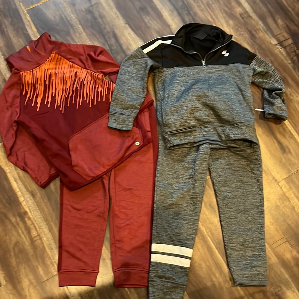 Multiple warm up outfits & an additional pair if warm up pants.
